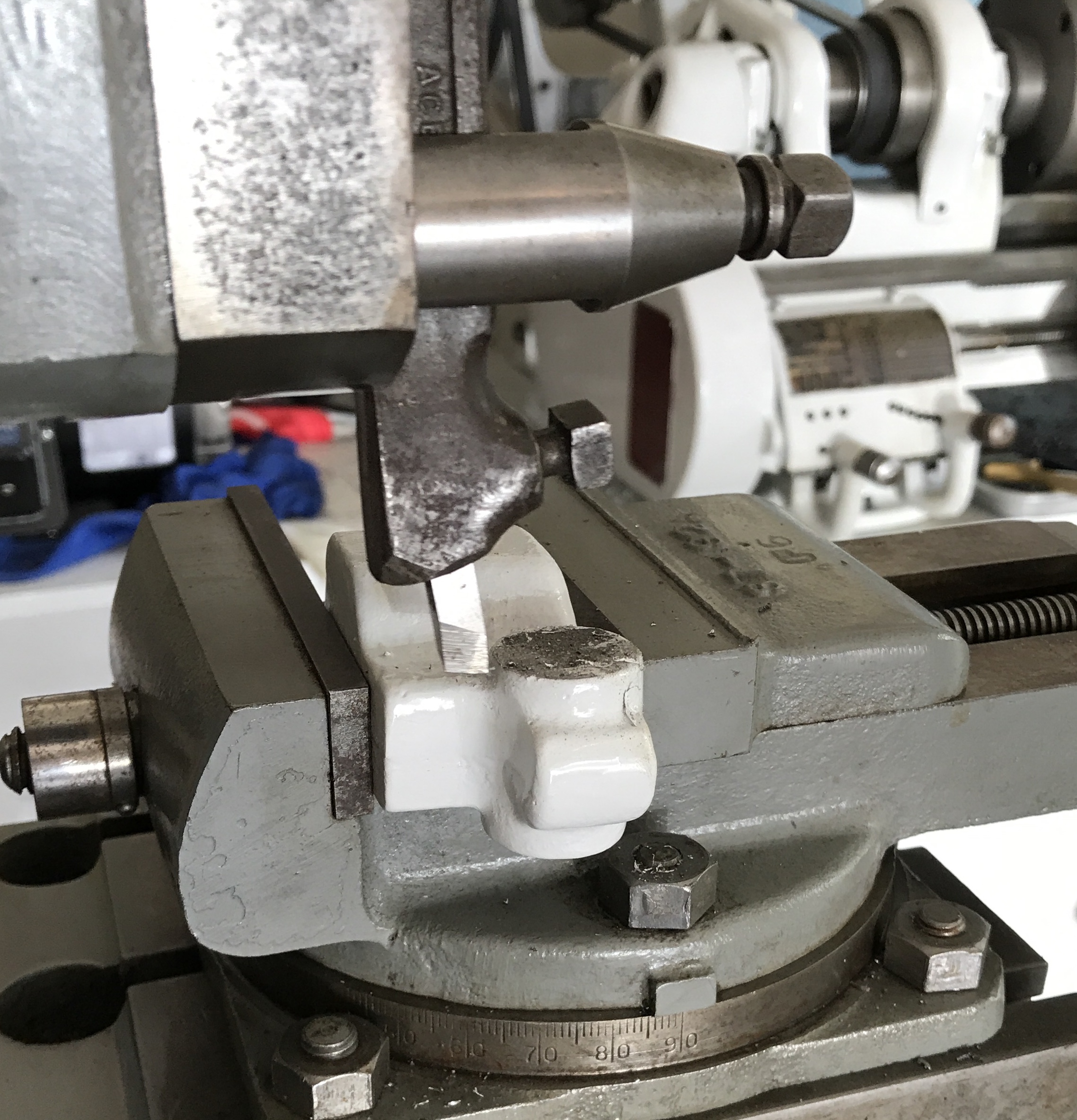 Saddle bracket clamped in vise